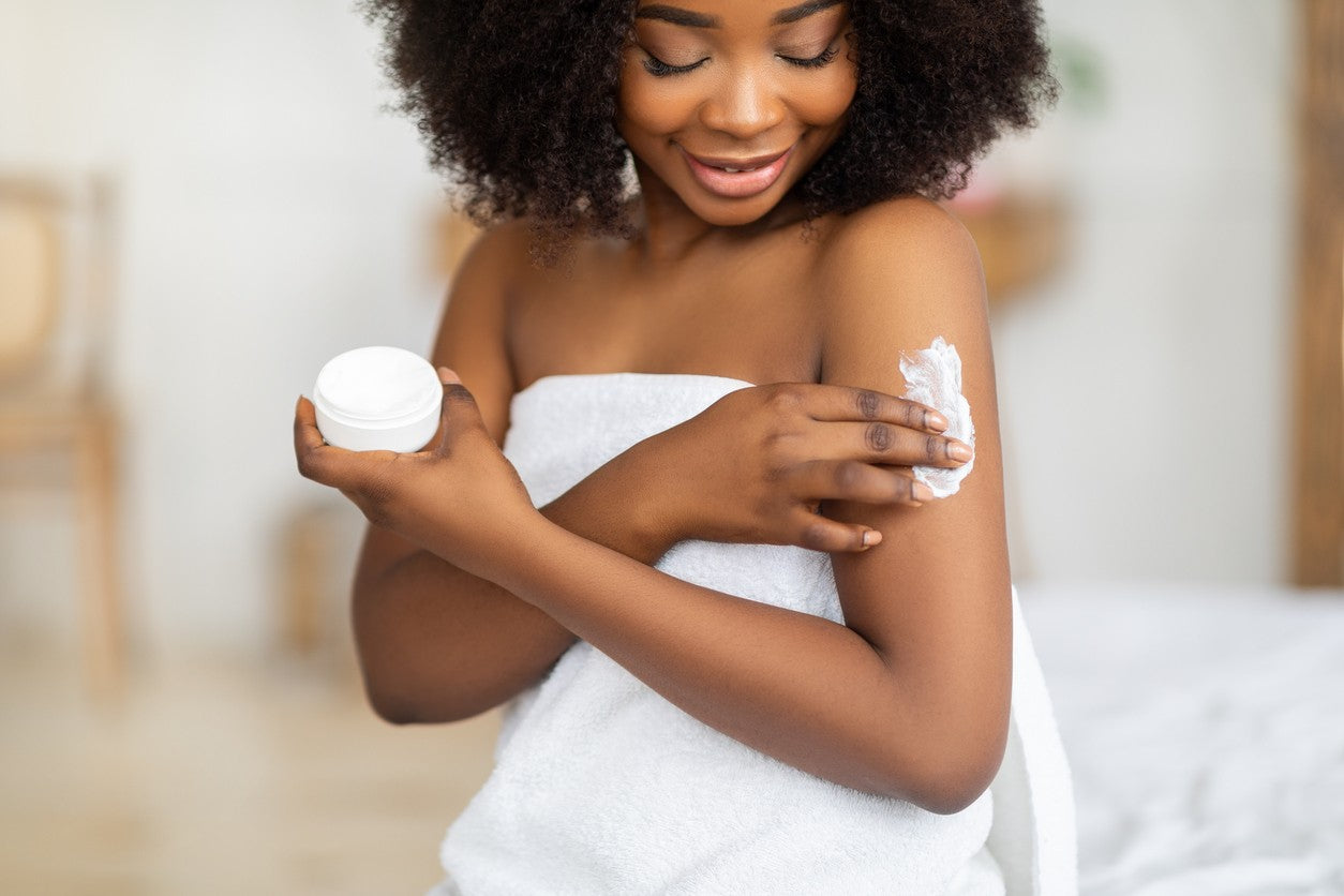 black-woman-putting-on-body-butter
